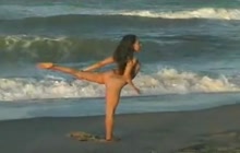 Girl in nude doing yoga outdoors