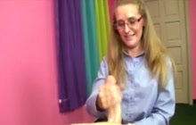 She gets on her knees to jerk a cock