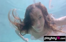 Petite Russian beauty Katya Clover showing her shaved pussy under the water